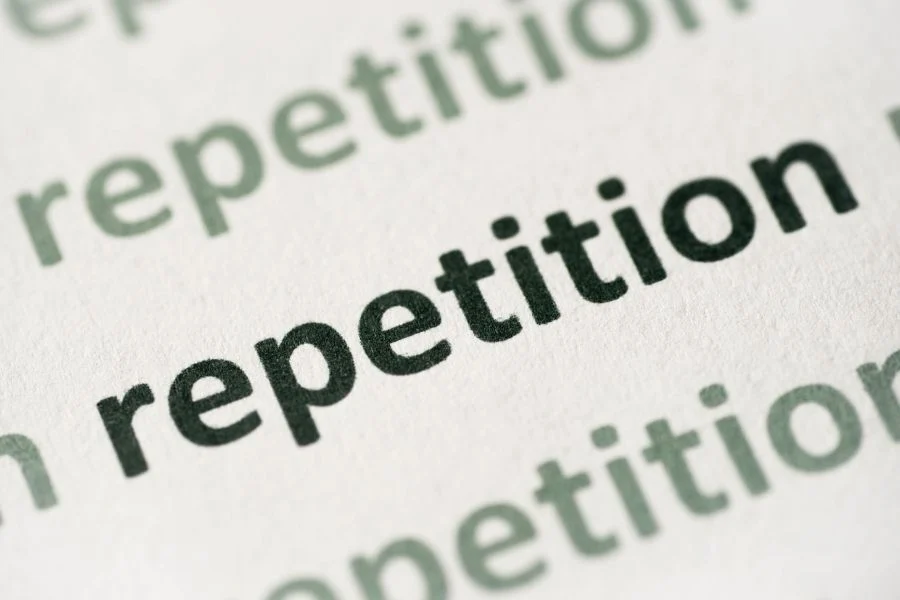 A writing showing 'repetition'